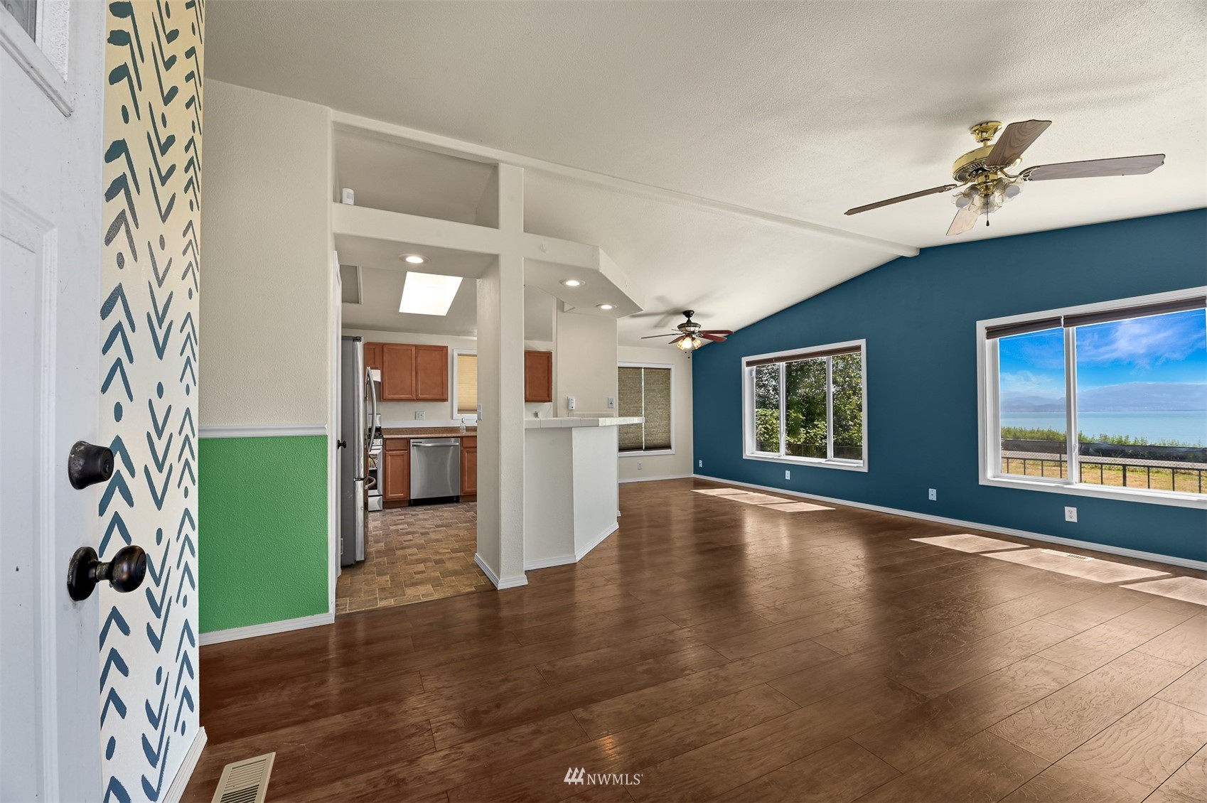 3053 Lummi Shore Road Bellingham, WA 98226 - Photo 5 of 37 a view of an empty room with window and wooden floor