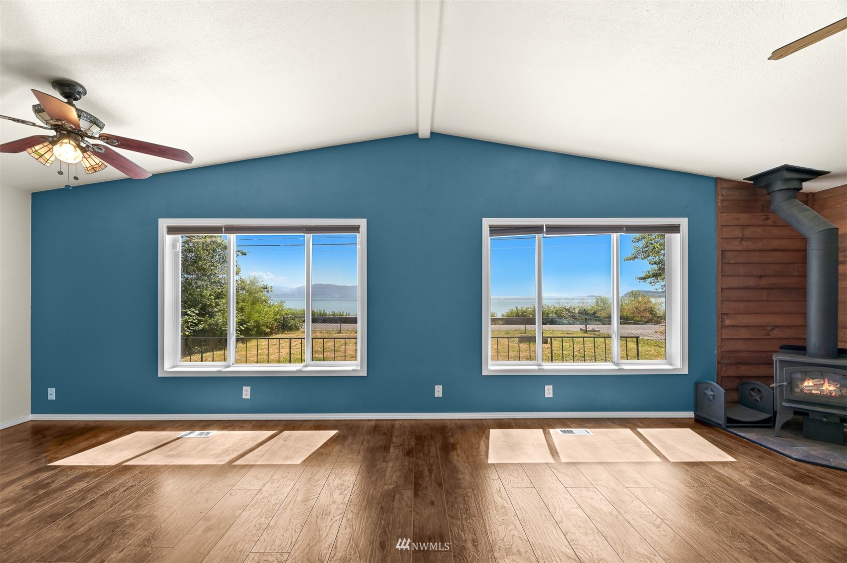 3053 Lummi Shore Road Bellingham, WA 98226 - Photo 6 of 37 a view of an empty room with window and wooden floor