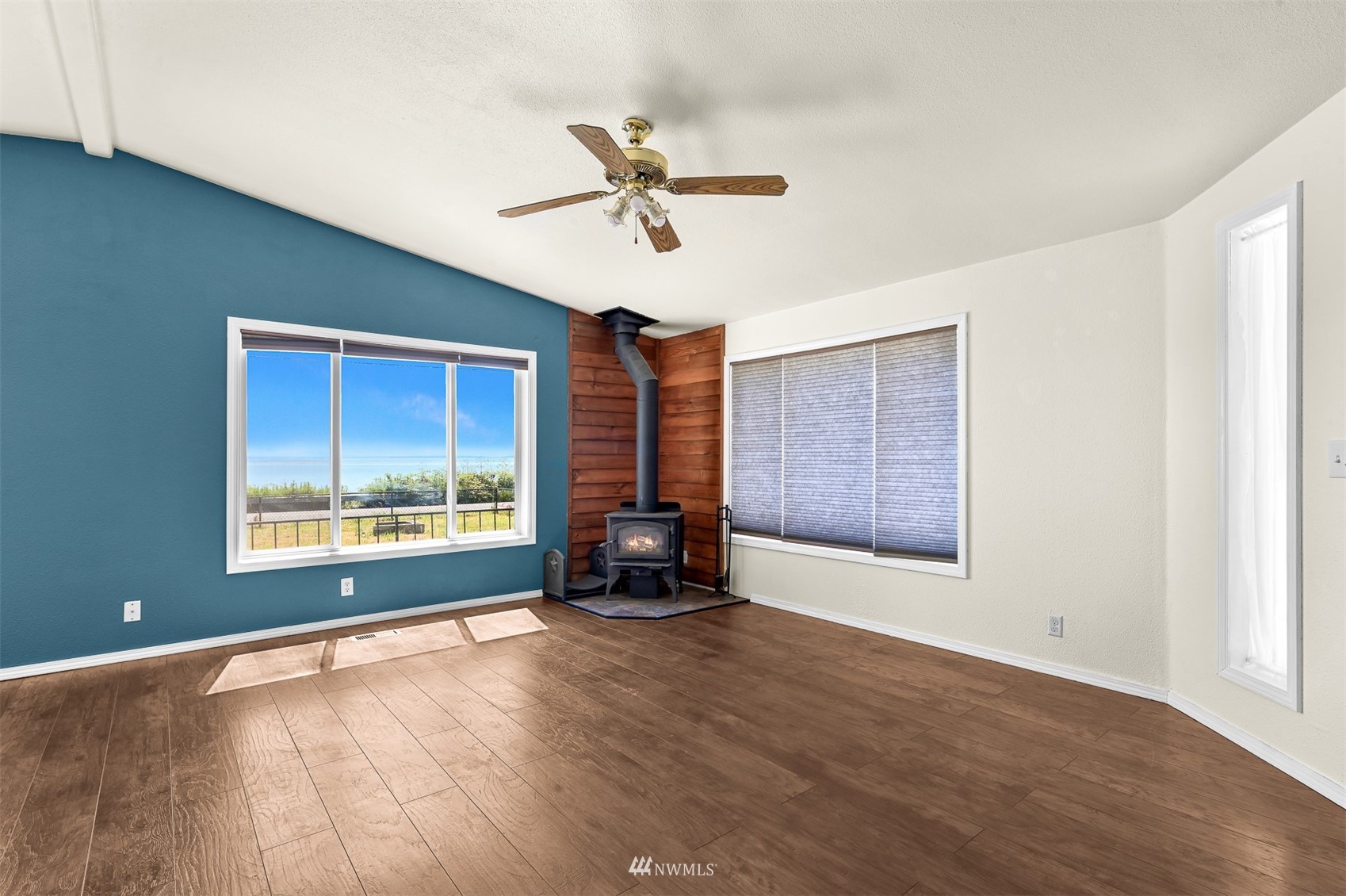 3053 Lummi Shore Road Bellingham, WA 98226 - Photo 9 of 37 a view of an empty room with a window and wooden floor