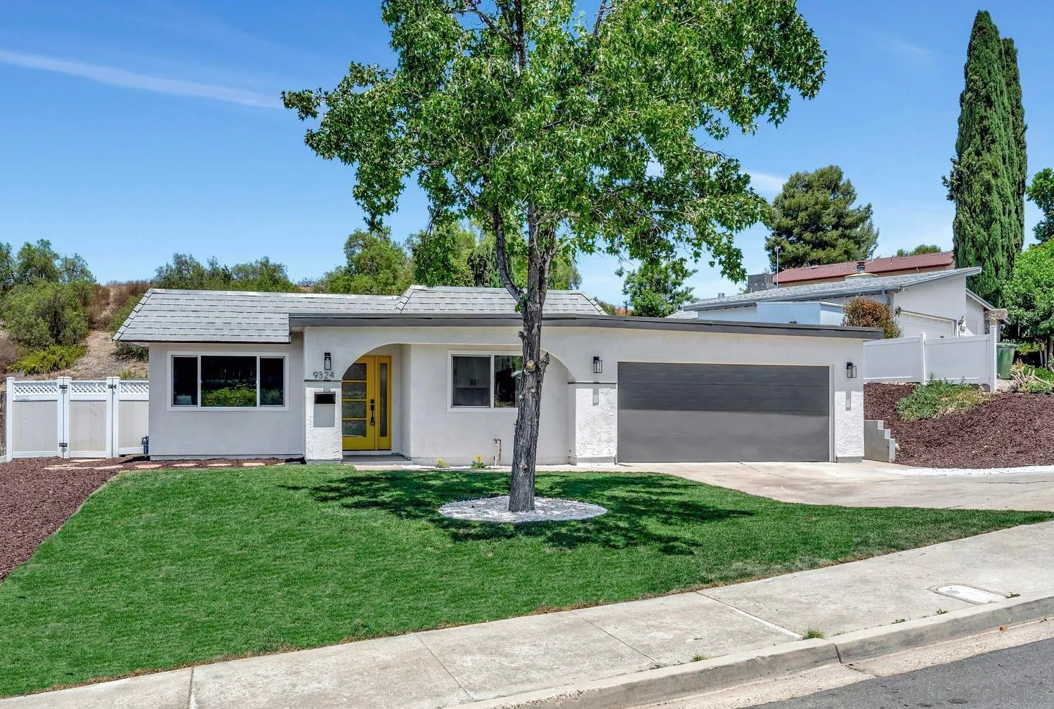 front view of a house with a yard