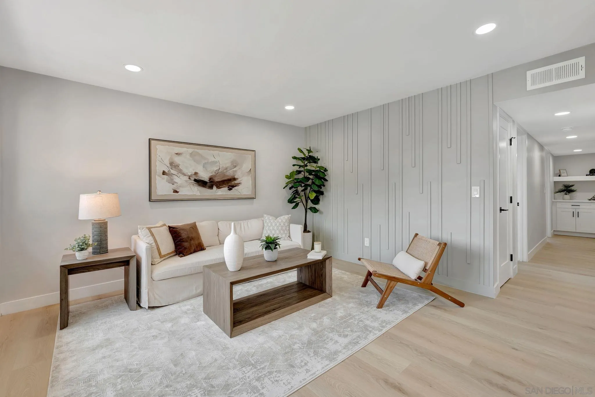 9324 Las Lomas Drive Santee, CA 92071 - Photo 6 of 11 a living room with furniture and a painting on the wall