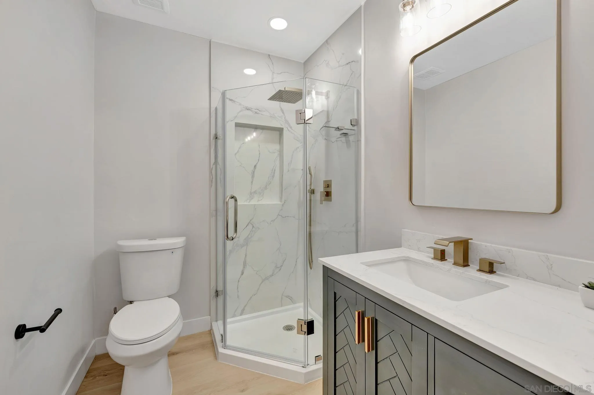 9324 Las Lomas Drive Santee, CA 92071 - Photo 8 of 11 a bathroom with a sink toilet and shower