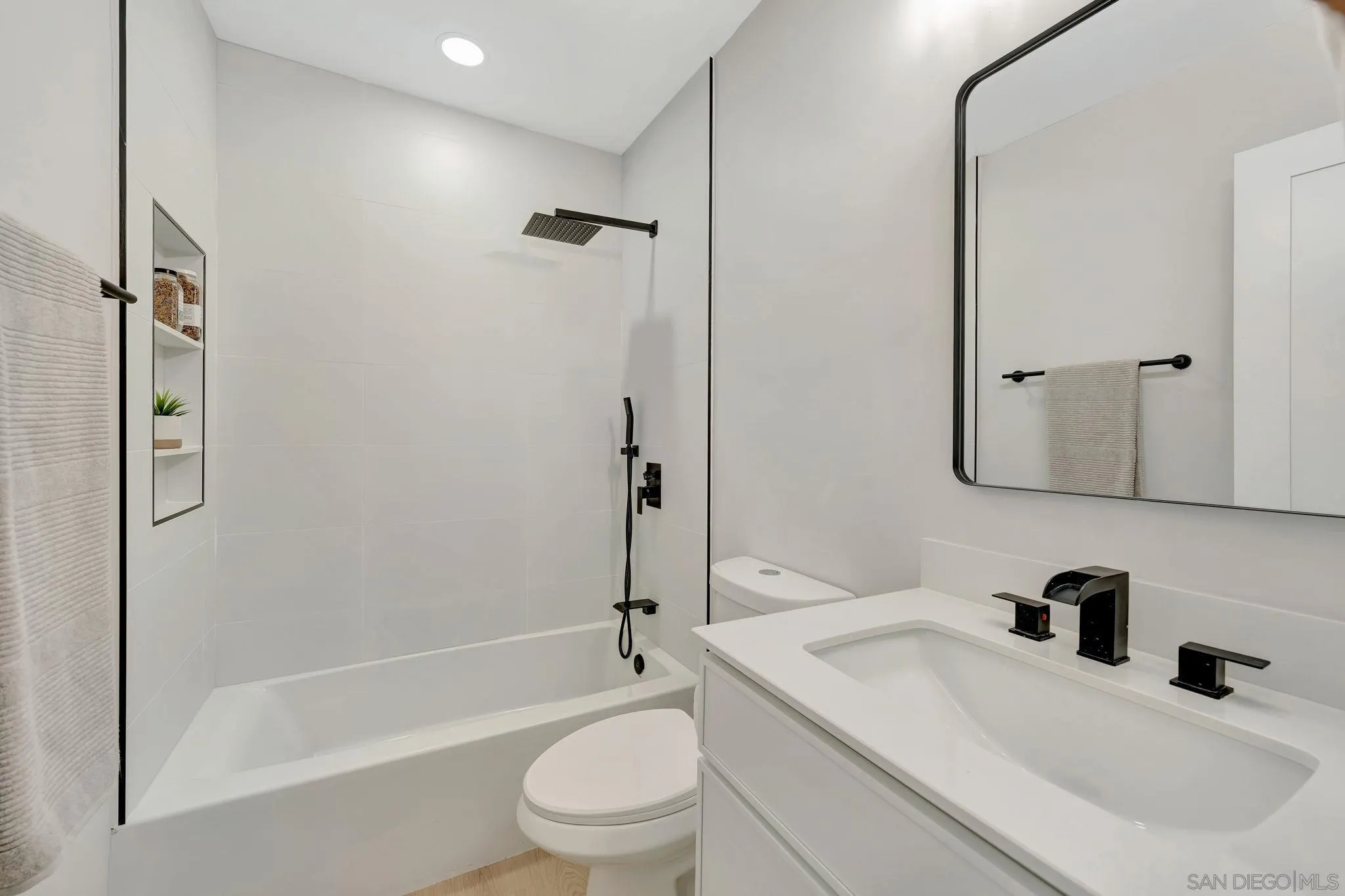 9324 Las Lomas Drive Santee, CA 92071 - Photo 9 of 11 a bathroom with a sink toilet and shower