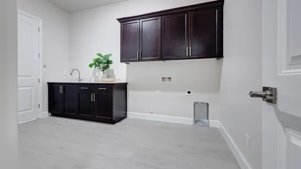 a spacious bathroom with a tub sink and mirror