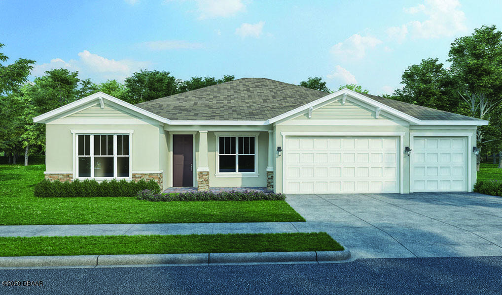 a front view of a house with a garden and yard