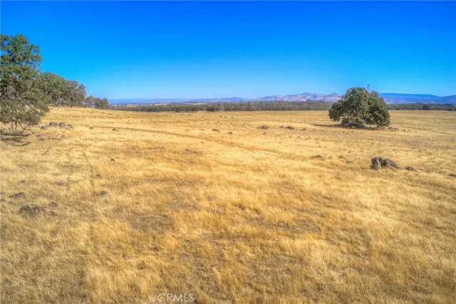 a view of an ocean and a mountain