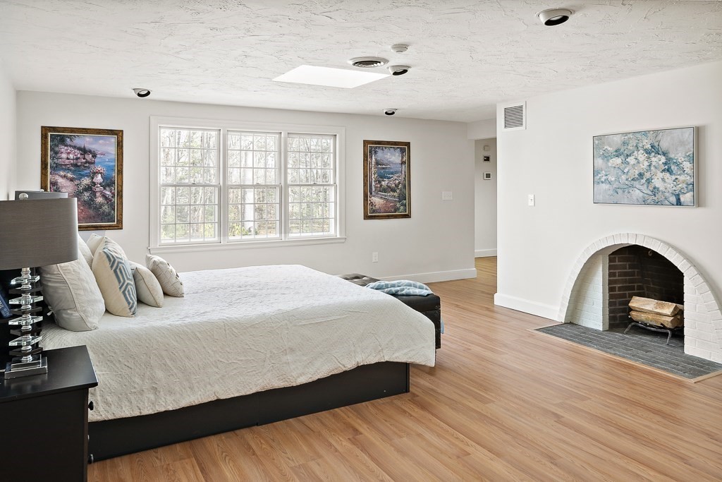 2 Partridge Hill Road Dover, MA 02030 - Photo 12 of 26 a bedroom with a bed and a fireplace