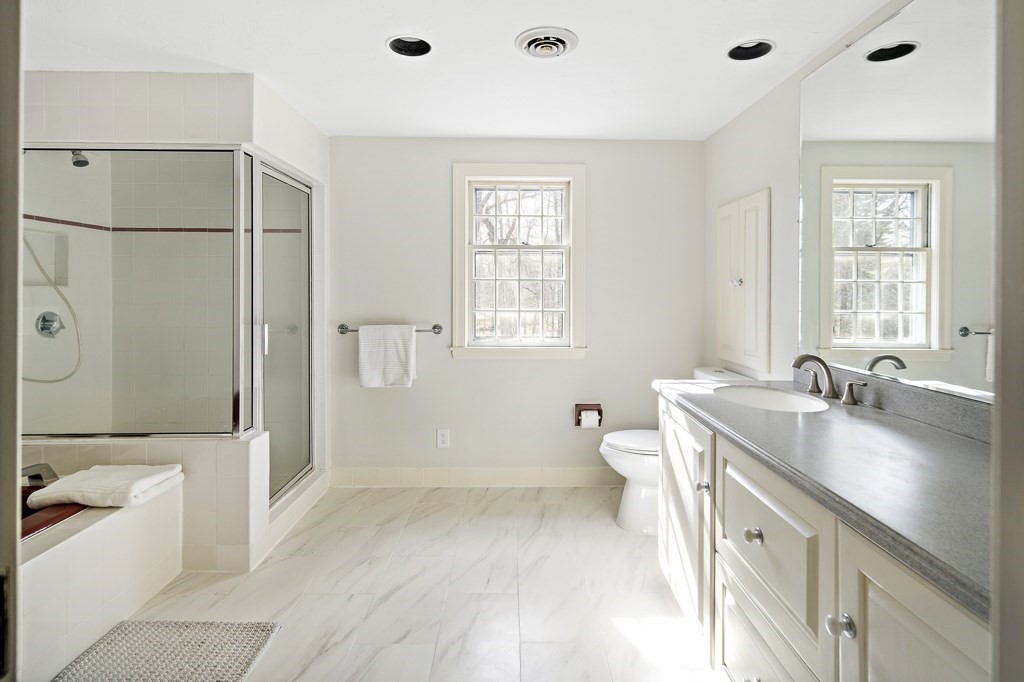 2 Partridge Hill Road Dover, MA 02030 - Photo 14 of 26 a bathroom with a granite countertop sink a toilet and shower