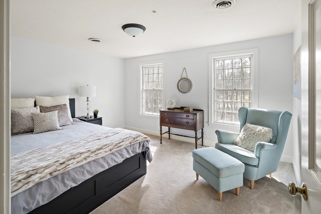 2 Partridge Hill Road Dover, MA 02030 - Photo 18 of 26 a bedroom with a bed and a chair