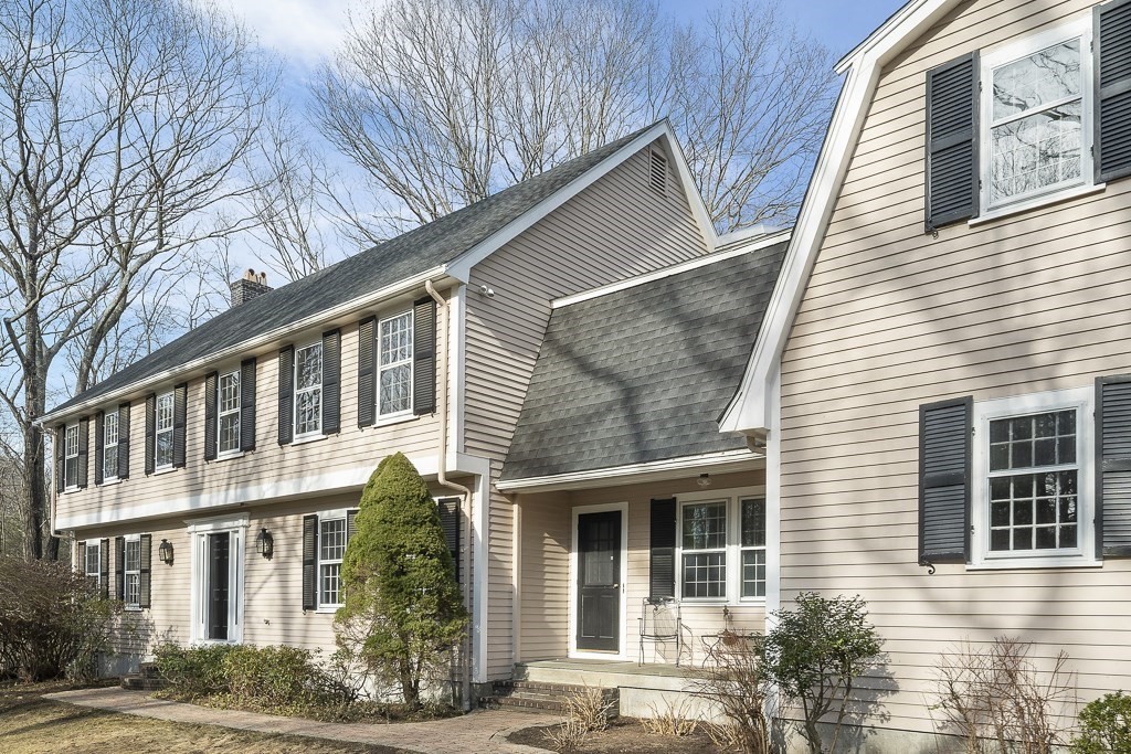 2 Partridge Hill Road Dover, MA 02030 - Photo 23 of 26 a front view of a house with garden