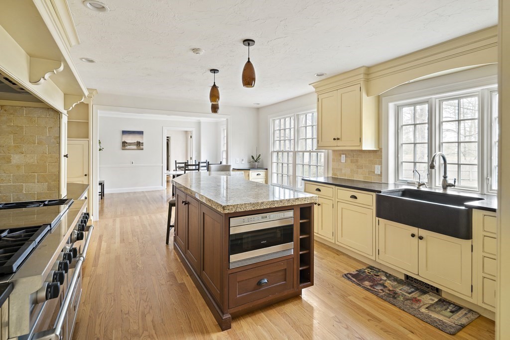 2 Partridge Hill Road Dover, MA 02030 - Photo 8 of 26 a kitchen with stainless steel appliances granite countertop a stove and a sink