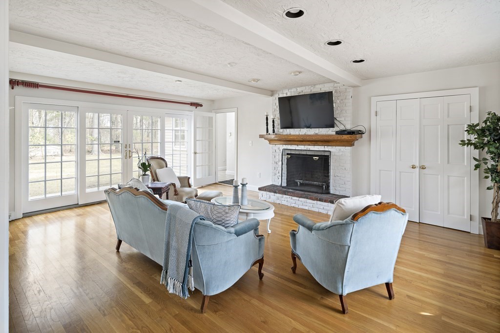 2 Partridge Hill Road Dover, MA 02030 - Photo 10 of 26 a living room with furniture and a fireplace