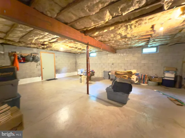 a room with fireplace and furniture