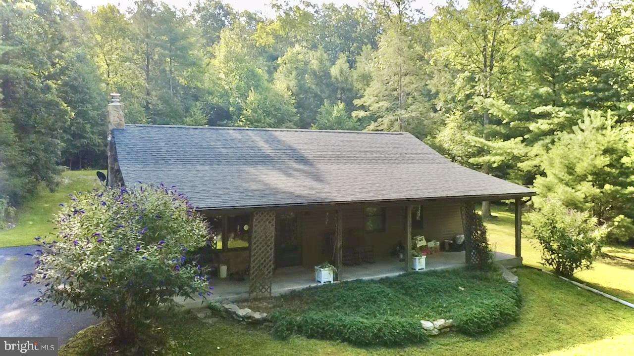 70 Kathryn Road McClure, PA 17841 - Photo 23 of 29 a view of a white house with a big yard and large trees