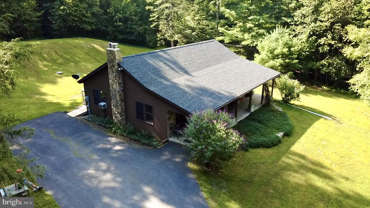 70 Kathryn Road McClure, PA 17841 - Photo 28 of 29 an aerial view of a house with a yard table and chairs
