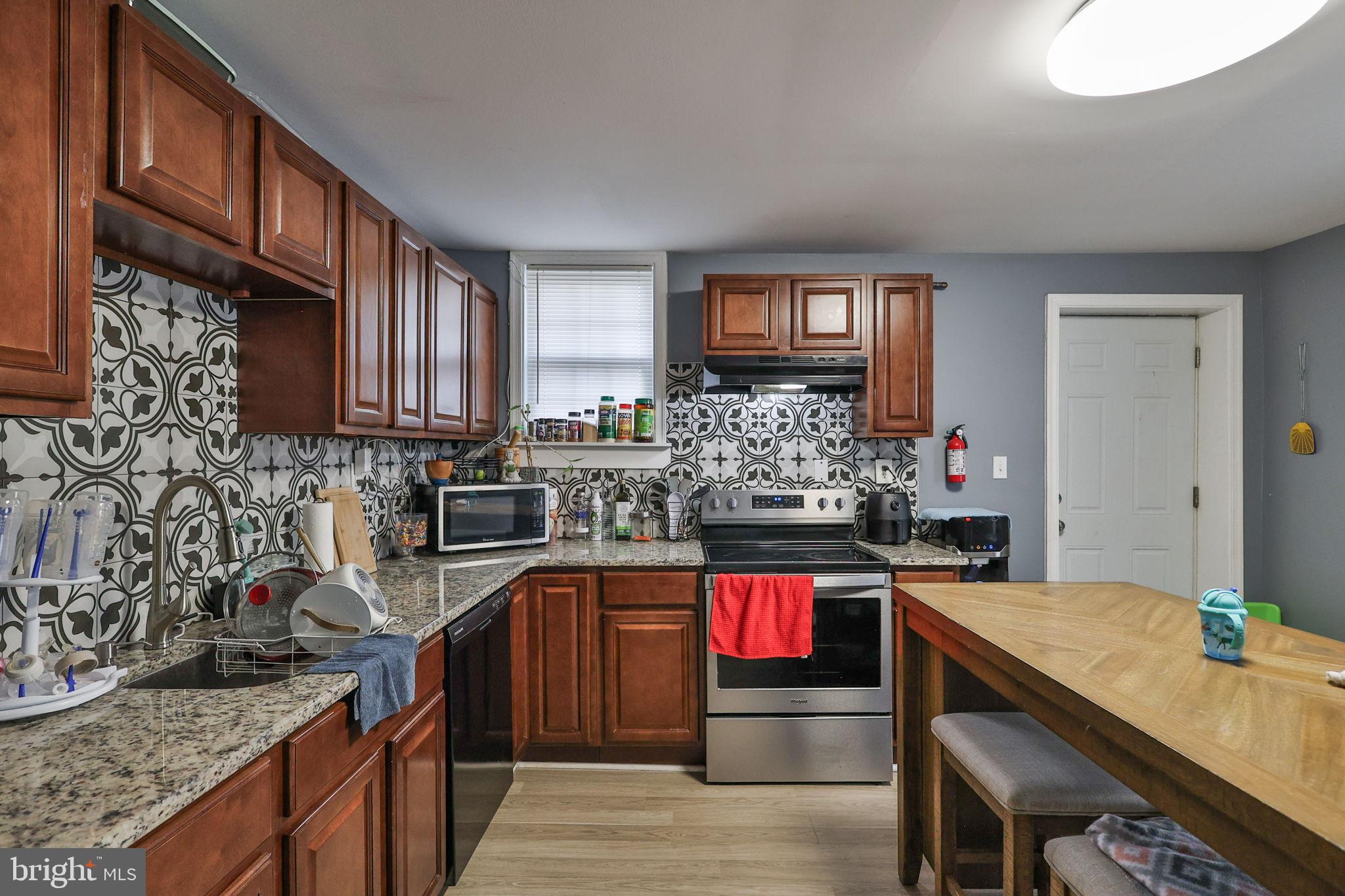 714 Ward Street Chester, PA 19013 - Photo 16 of 40 a kitchen with granite countertop lots of counter top space