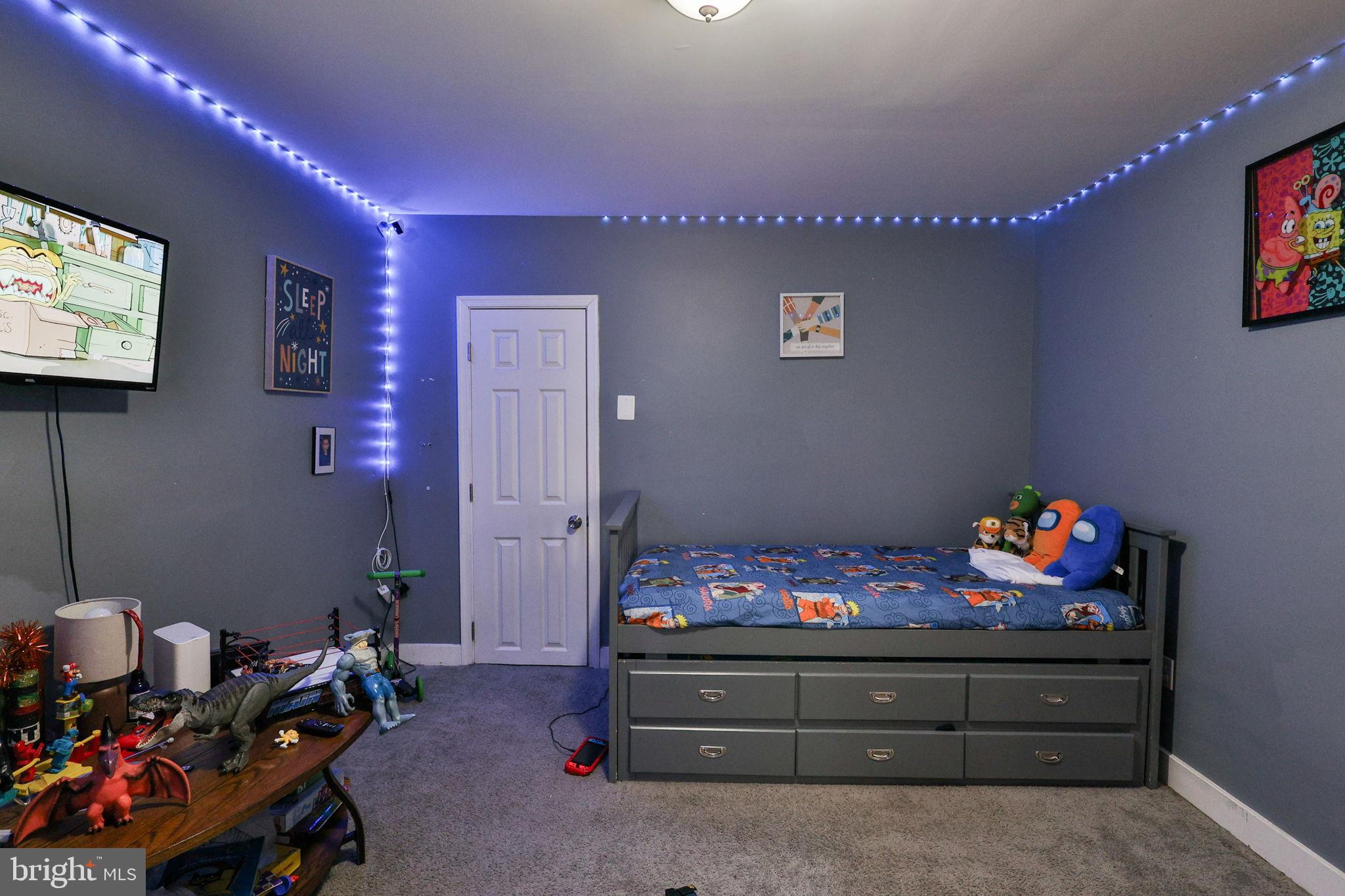714 Ward Street Chester, PA 19013 - Photo 22 of 40 a bedroom with furniture and a flat screen tv