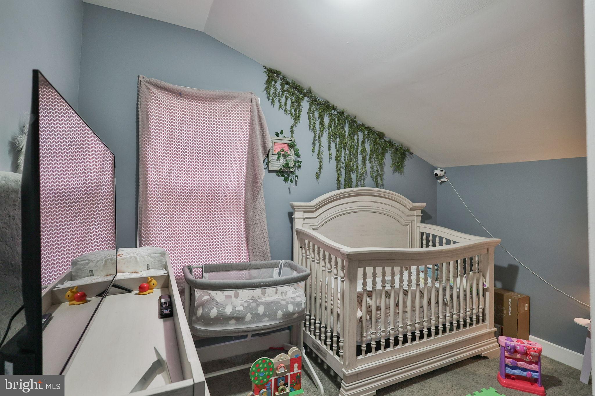 714 Ward Street Chester, PA 19013 - Photo 30 of 40 a bedroom with furniture and a window