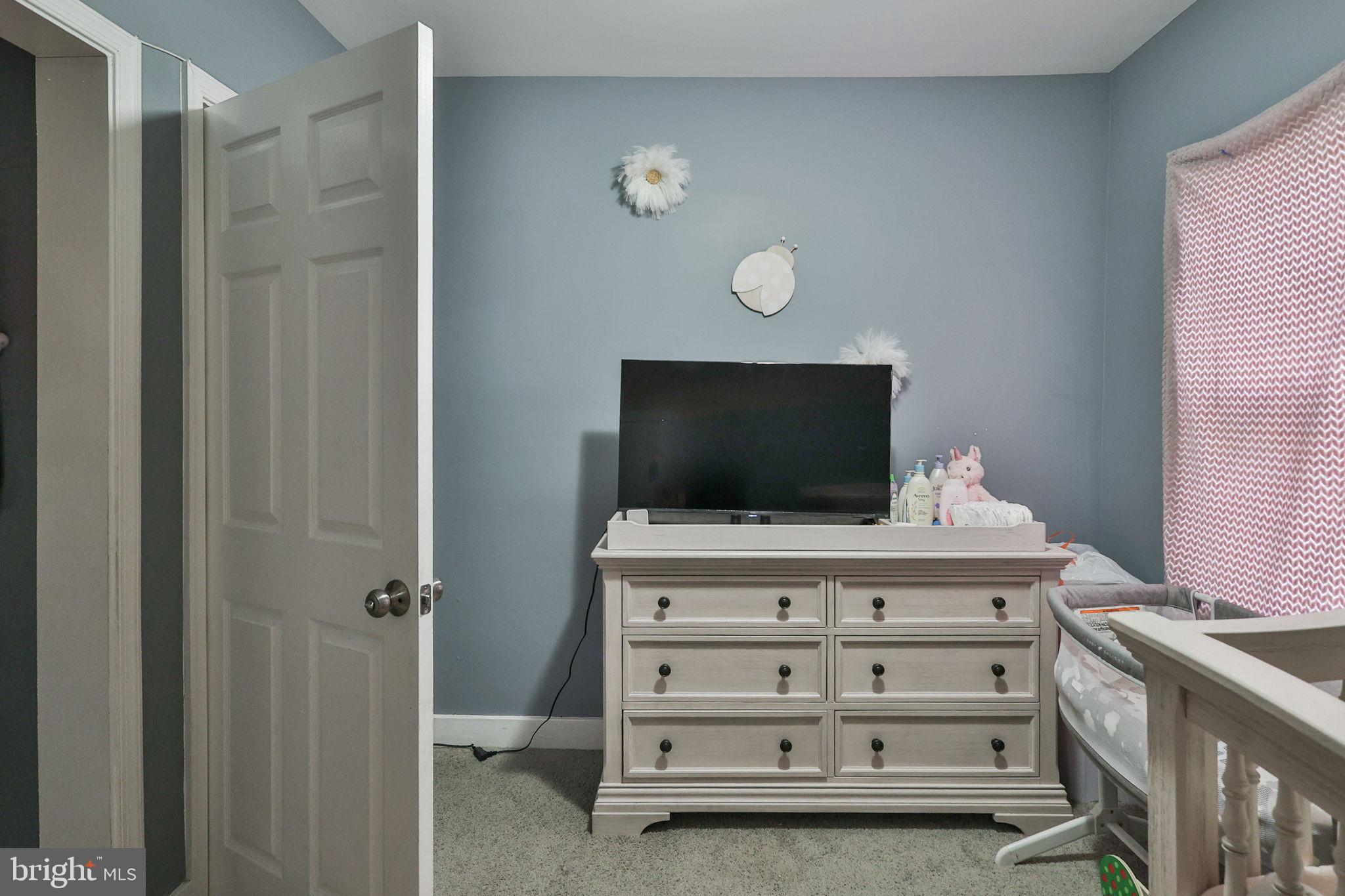 714 Ward Street Chester, PA 19013 - Photo 33 of 40 a room with a furniture and a flat screen tv