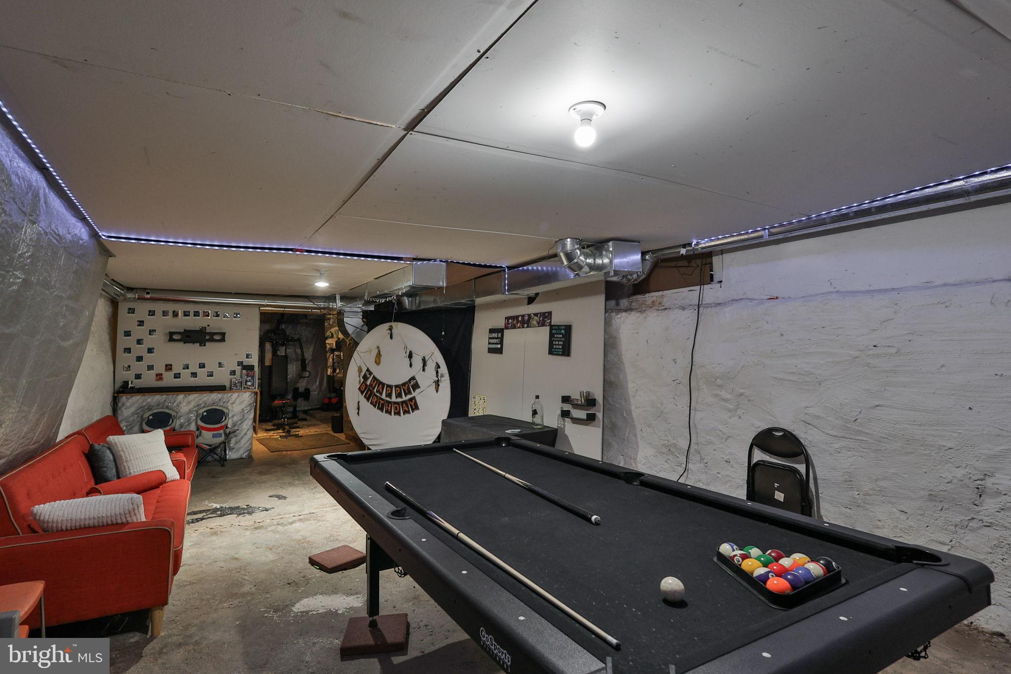 714 Ward Street Chester, PA 19013 - Photo 39 of 40 a living room with furniture a clock and a rug