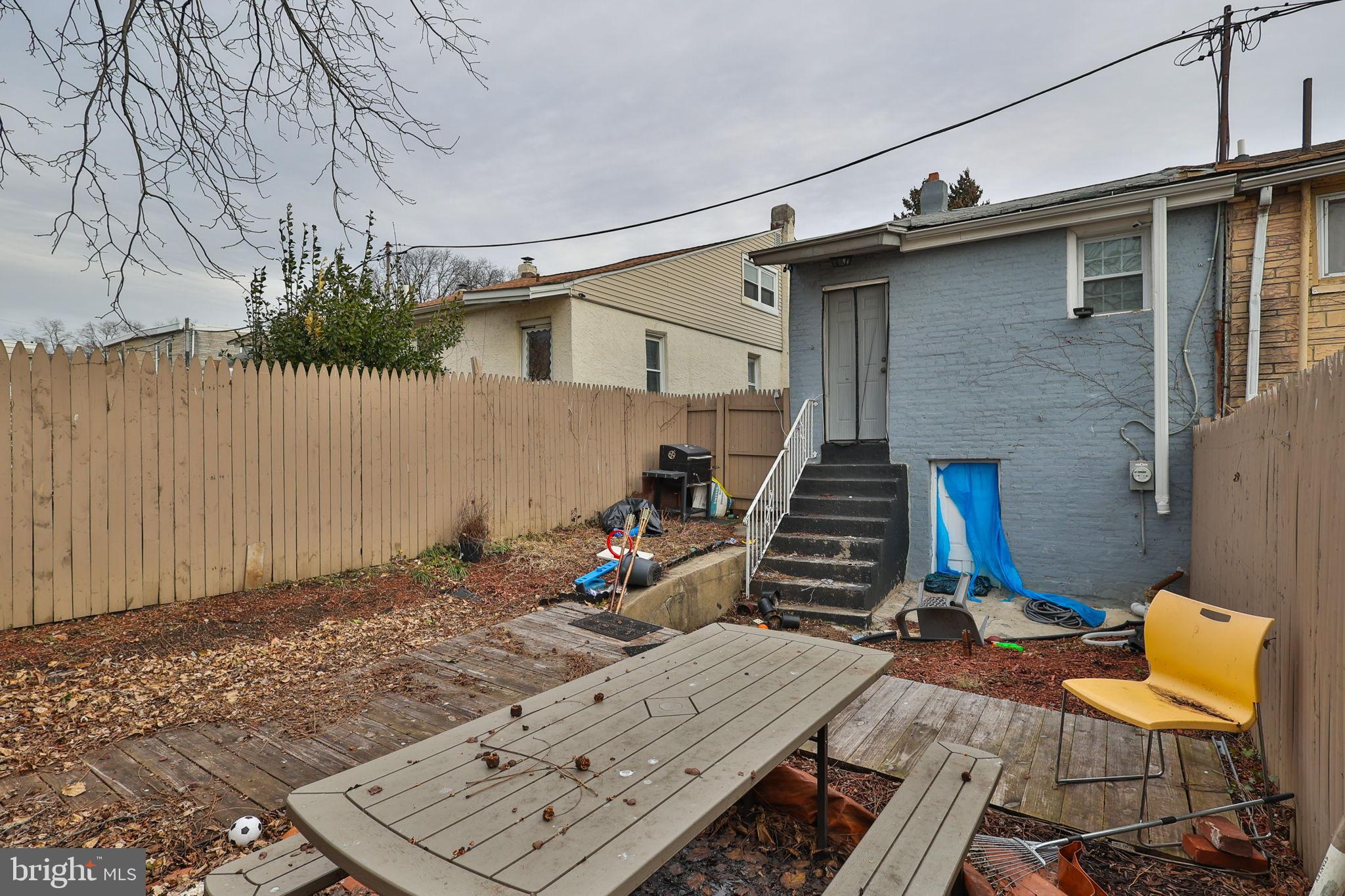 714 Ward Street Chester, PA 19013 - Photo 40 of 40 a view of a patio with a table and chairs