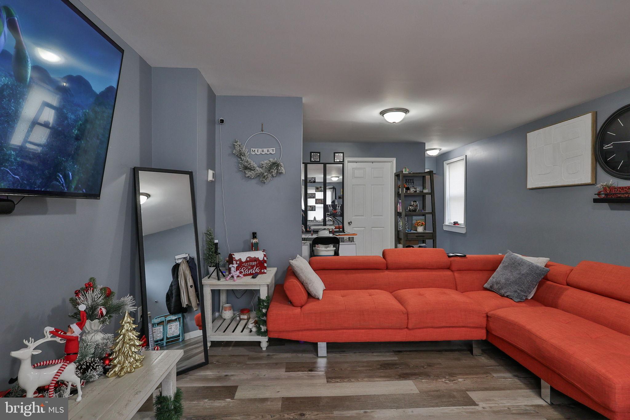 714 Ward Street Chester, PA 19013 - Photo 7 of 40 a living room with furniture and wooden floor