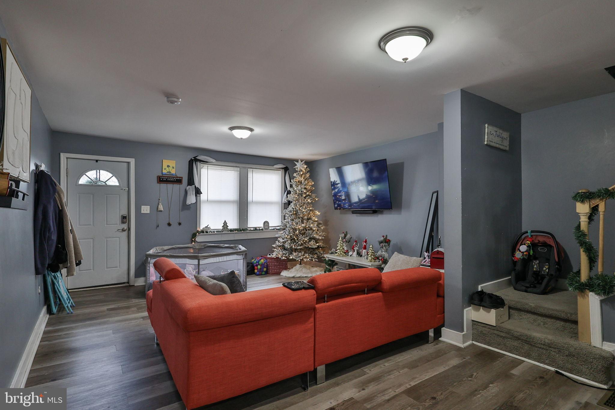 714 Ward Street Chester, PA 19013 - Photo 10 of 40 a living room with furniture and a flat screen tv