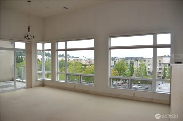 a view of an empty room with a large window