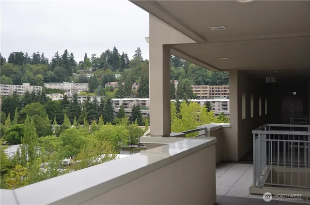 a view of a porch with furniture and garden