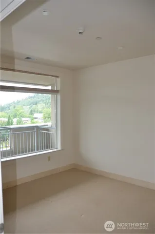 a view of a small space with a large window