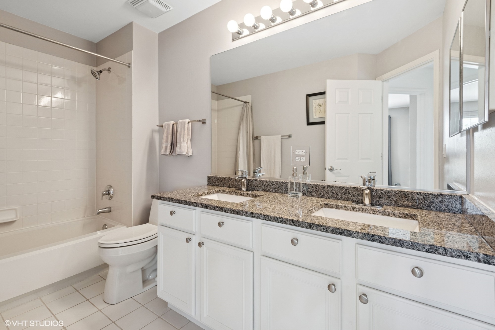 62 Andover Circle Northbrook, IL 60062 - Photo 16 of 23 a bathroom with a granite countertop sink double vanity and a mirror