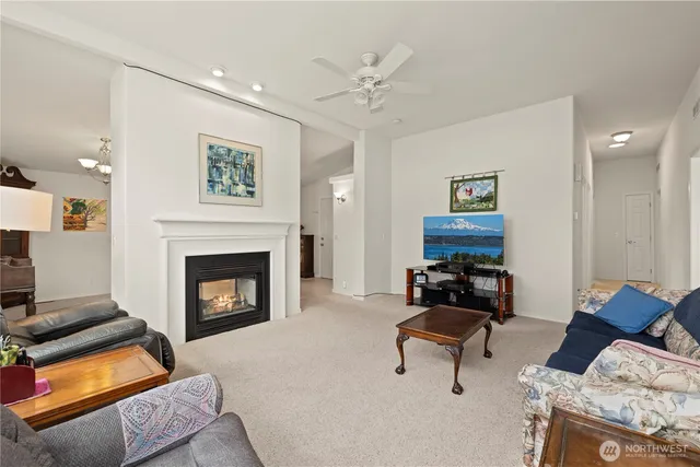 a living room with furniture and a piano
