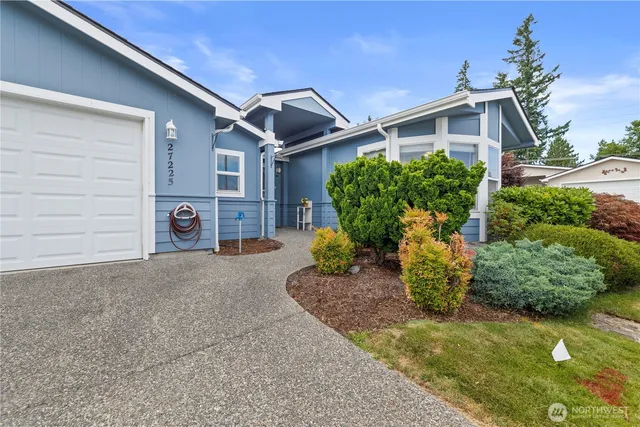 a front view of a house with garden