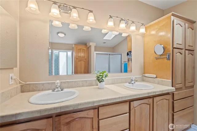 a view of walk in closet with clothes