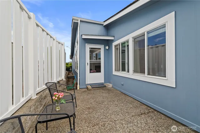 a front view of a house with a garden and plants