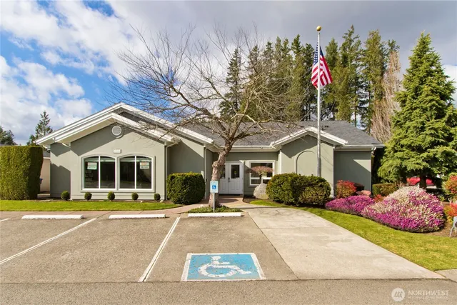 a living room with furniture and a book shelf