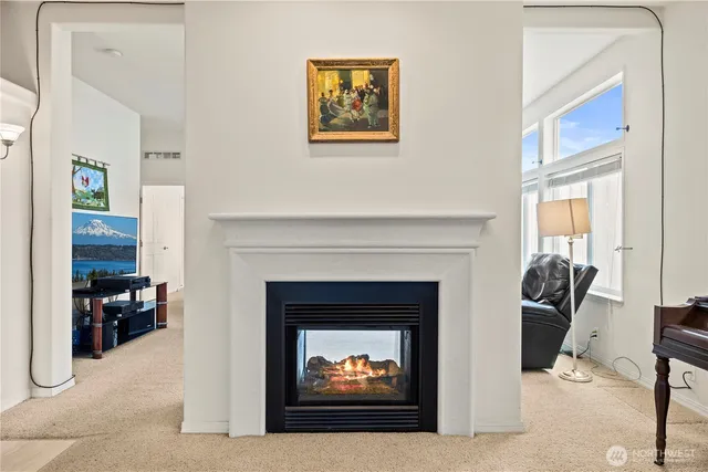 a large white kitchen with a large window