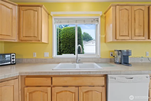 a dining table chair next to a window