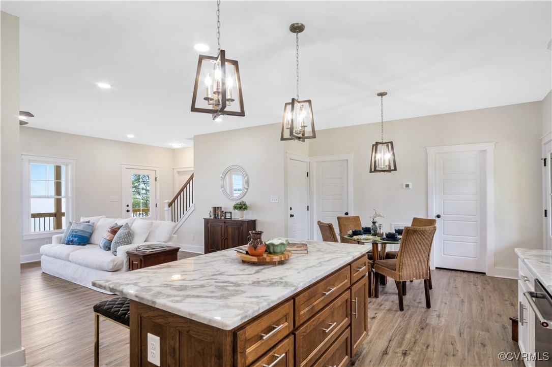 767 Sunken Meadow Road Spring Grove, VA 23881 - Photo 12 of 39 a view of a dining room with furniture and wooden floor