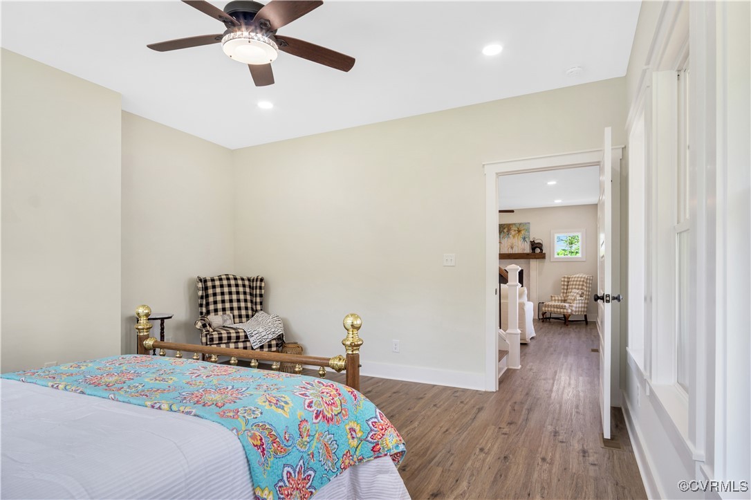 767 Sunken Meadow Road Spring Grove, VA 23881 - Photo 24 of 39 a bedroom with a bed and wooden floor