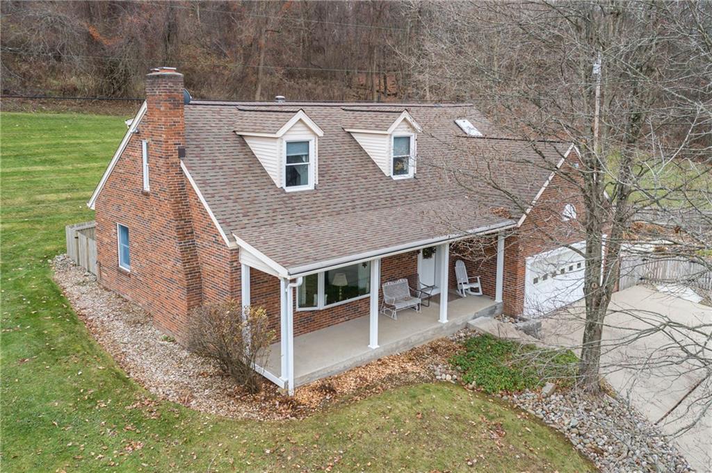 155 Cove Road Washington, PA 15301 - Photo 3 of 39 a front view of a house with garden