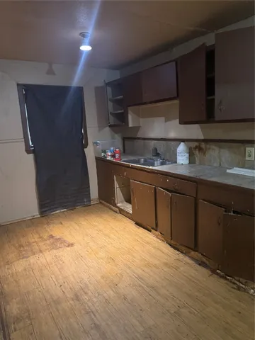 a view of an empty room and entryway