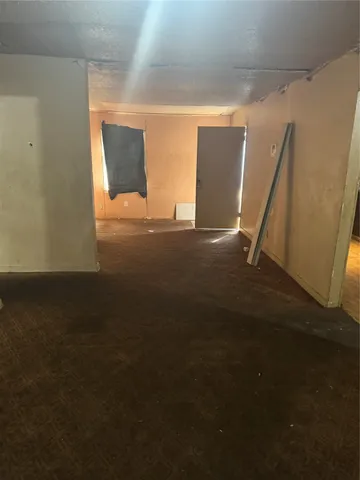 a room with gym equipment and windows