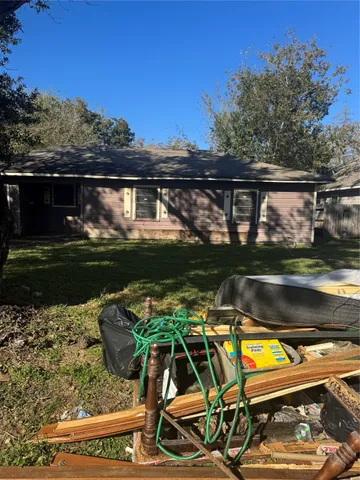 a view of swimming pool with lawn chairs and a yard