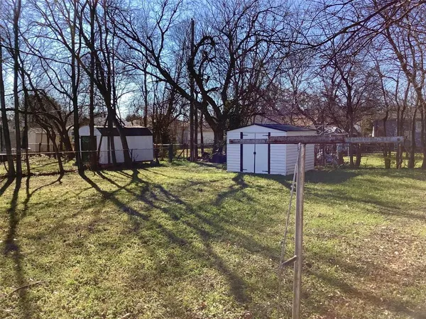 a view of a house with a yard covered in snow