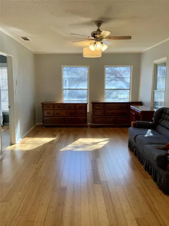 a view of room with furniture wooden floor and window
