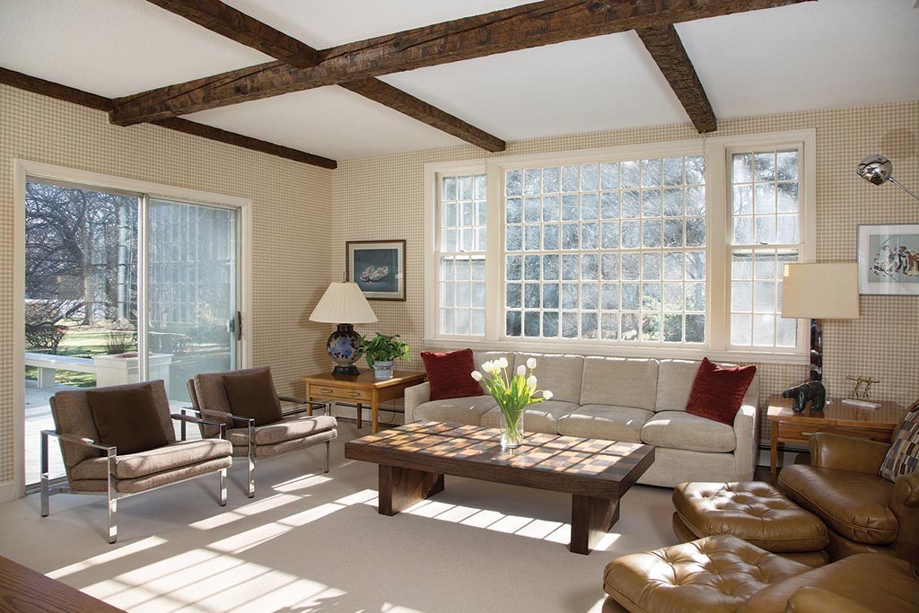 134 Annawan Road Newton, MA 02468 - Photo 5 of 8 a living room with furniture and floor to ceiling windows