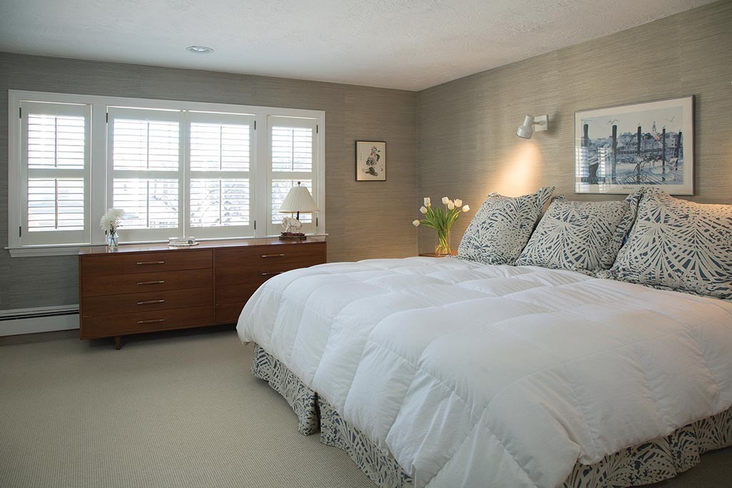 134 Annawan Road Newton, MA 02468 - Photo 6 of 8 a large bed sitting in a bedroom next to a window