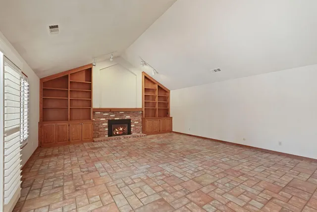 a view of livingroom with furniture and fireplace