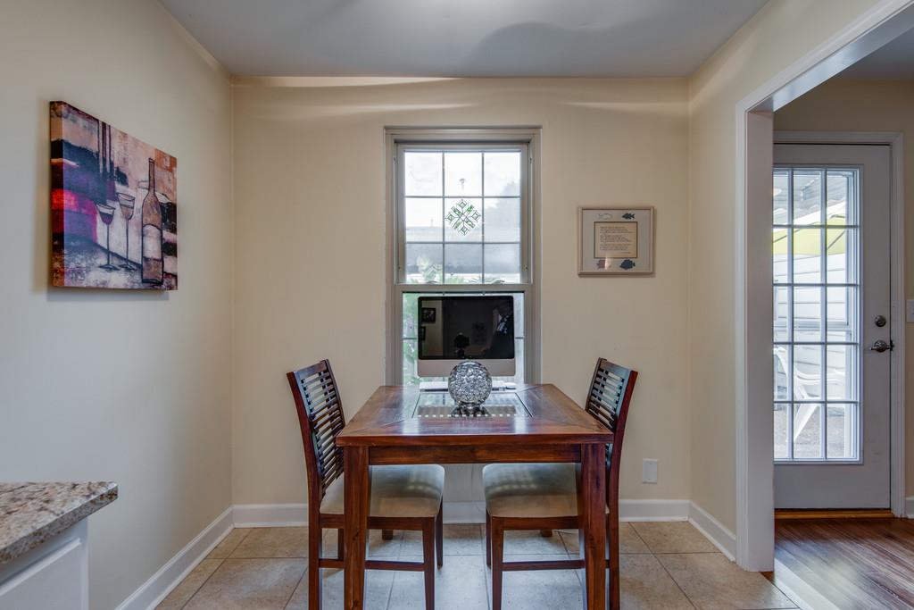 1056 General George Patton Road, Unit 1056 Nashville, TN 37221 - Photo 16 of 30 a view of a dining room with furniture window and wooden floor